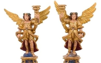* A Pair of Italian Painted and Gilt Figural Candlesticks