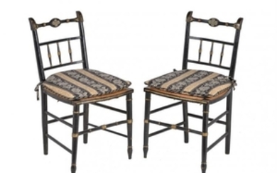 A pair of Regency black painted side chairs
