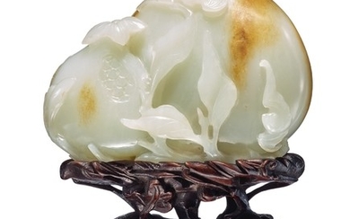 A WHITE AND RUSSET JADE 'PEACH AND POMEGRANATE' GROUP QING DYNASTY, QIANLONG PERIOD