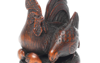 A wood netsuke of a family of chickens