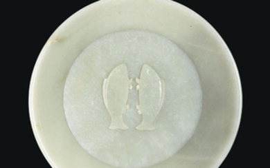 AN IMPORTANT AND EXTREMELY RARE IMPERIALLY INSCRIBED GREENISH-WHITE JADE ''TWIN FISH'' WASHER, CHINA, QING DYNASTY, QIANLONG INCISED FOUR-CHARACTER MARK AND OF THE PERIOD, DATED BY INSCRIPTION TO THE CYCLICAL BINGWU YEAR, CORRESPONDING TO 1786