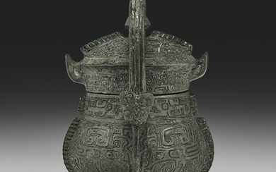 A VERY RARE MINIATURE BRONZE RITUAL WINE VESSEL AND COVER, YOU, LATE SHANG DYNASTY, 12TH-11TH CENTURY BC