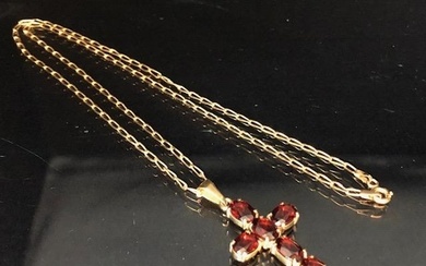 9ct Gold chain with a 9ct Gold pendant cross set with garnet...
