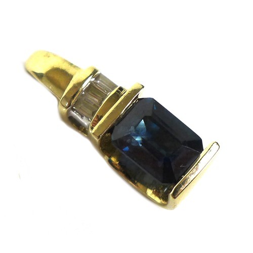 A 14ct gold, synthetic sapphire, and diamond pendant, the ro...
