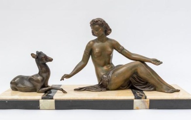 A 1930's mantle garniture of Diana with a buck on...