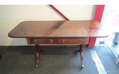 A 19th Century Regency mahogany sofa table with twist suppor...