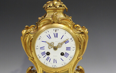 A 19th century French ormolu mantel clock with eight day movement striking hours and half hours on a