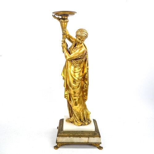 A 19th century gilt-bronze lamp base, supported by a robed C...