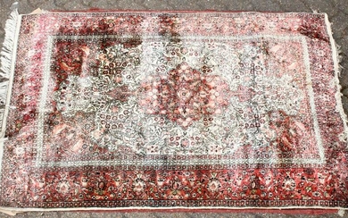 A 20TH CENTURY PART SILK PERSIAN RUG, beige ground with