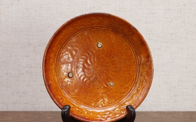 A Chinese amber-glazed saucer