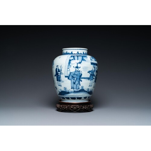 A Chinese blue and white vase with narrative design on woode...