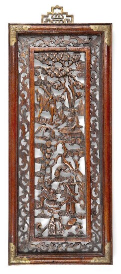 A Chinese carved wood panel, early 20th century, carved and pierced with various Immortals amongst pine trees, clouds and mountains, 52.5cm x 22.5cm