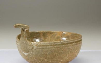 A Chinese celadon-glazed stoneware handled bowl