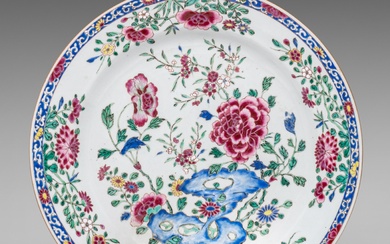 A Chinese famille rose 'Poeny garden' export porcelain charger, Yongzheng/Qianlong period, dia 38 cm