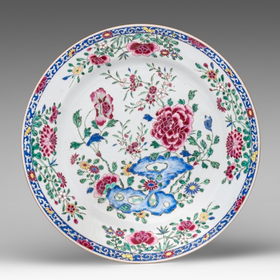 A Chinese famille rose 'Poeny garden' export porcelain charger, Yongzheng/Qianlong period, ø 38 cm