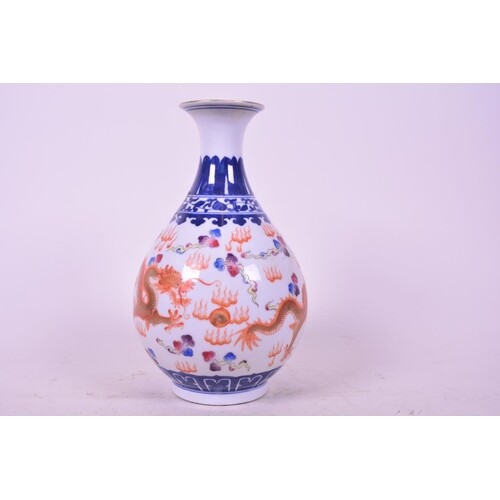 A Chinese porcelain bulbous vase decorated in red and gilt w...