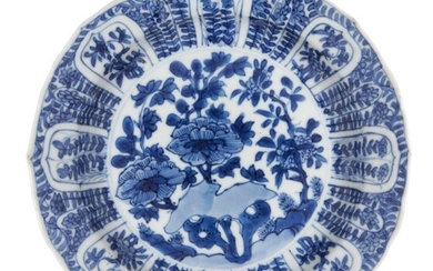 A Chinese porcelain dish, Kangxi period, painted in underglaze blue...