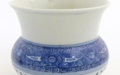 A Chinese pot / vase of squat form with a round body