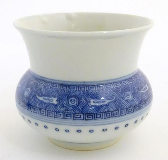 A Chinese pot / vase of squat form with a round body