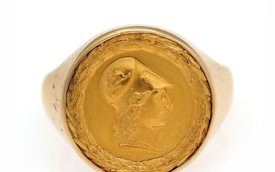 SOLD. A Doctor's ring set with a plate of 21.6k gold embossed with Minerva's head...