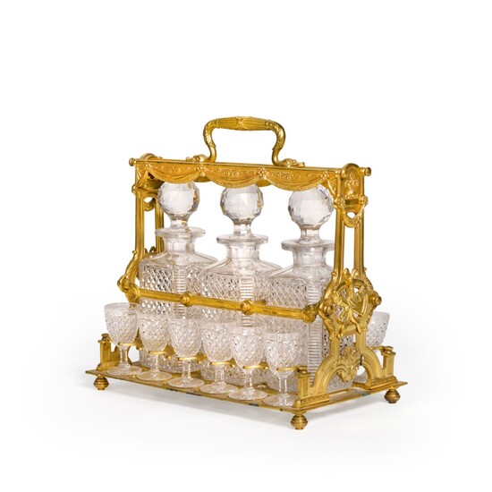 A FRENCH GILT-METAL AND CUT-GLASS TANTALUS, LATE 19TH CENTURY