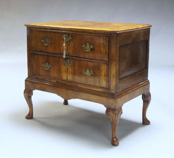 A French Louis Philippe style walnut and parquetry inlaid centre table, late 20th century, the circular top inlaid with sunburst motif above two frieze drawers raised on four cabriole legs with bronze paw feet united by shaped undertier raised on...