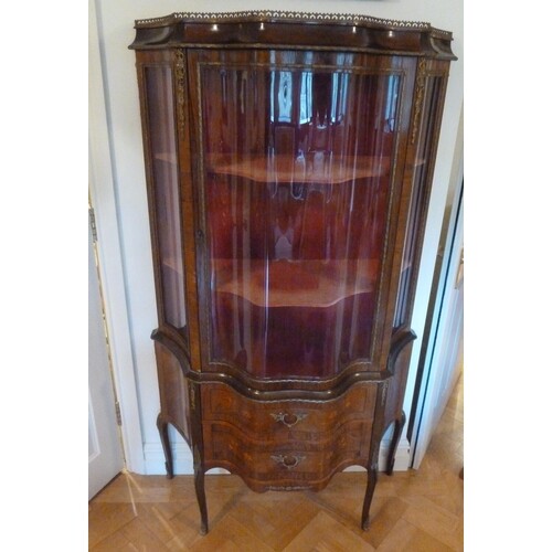A French style serpentine fronted glazed display cabinet, th...
