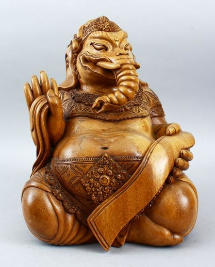 A GOOD QUALITY CARVED WOODEN INDIAN FIGURE OF GANESH