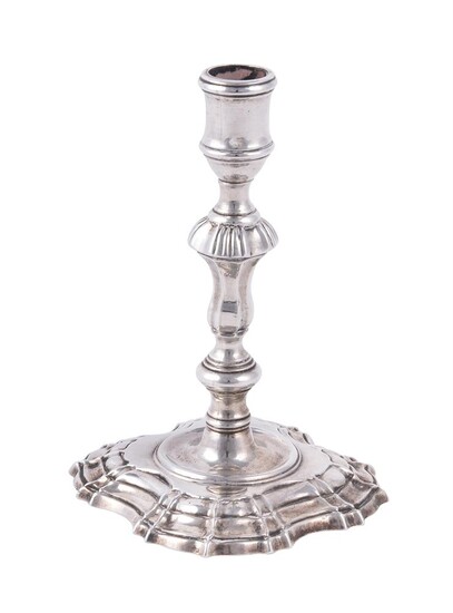A George II cast silver taperstick by Simon Jouet