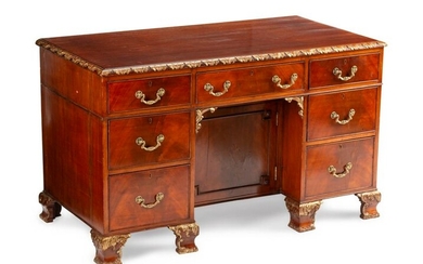 A George III Style Parcel-Gilt Mahogany Kneehole Desk