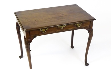 A George III mahogany side table with a moulded top above a ...