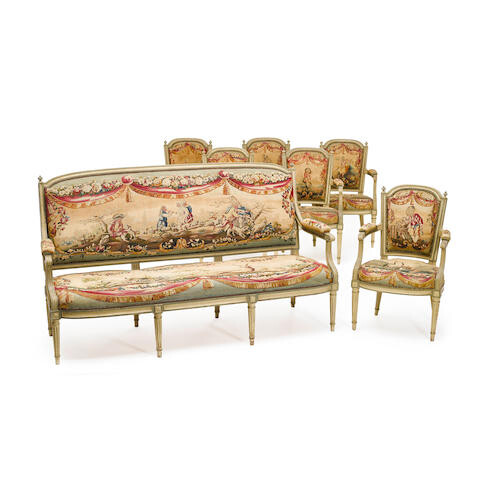 A LOUIS XVI STYLE NEEDLEPOINT UPHOLSTERED PAINTED WOOD FOUR PIECE PARLOR SUITE