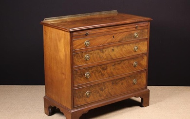 A Late Georgian Flame Mahogany Chest of Drawers with brushing slide. The flame figured top having a