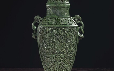 A MASSIVE AND FINELY-CARVED SPINACH-GREEN JADE TWO-HANDLED VASE AND COVER