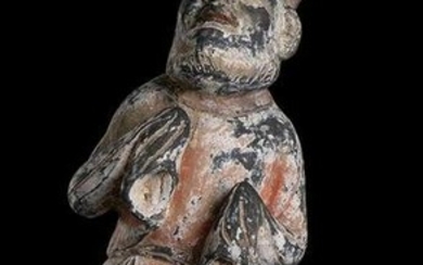 A PAINTED POTTERY FIGURE OF A BEARDED FOREIGNER China