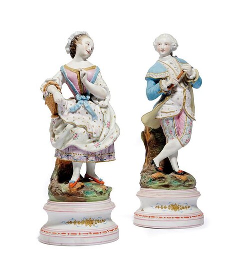 A PAIR OF CONTINENTAL BISCUIT PORCELAIN FIGURES LATE 19TH CENTURY of a well dressed gentleman...