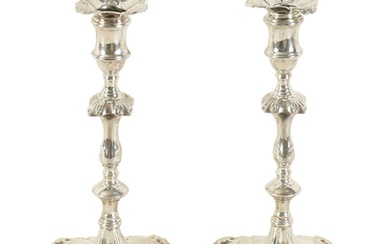 A PAIR OF GEORGE III CAST SILVER 'ROCOCO' CANDLESTICKS with ...
