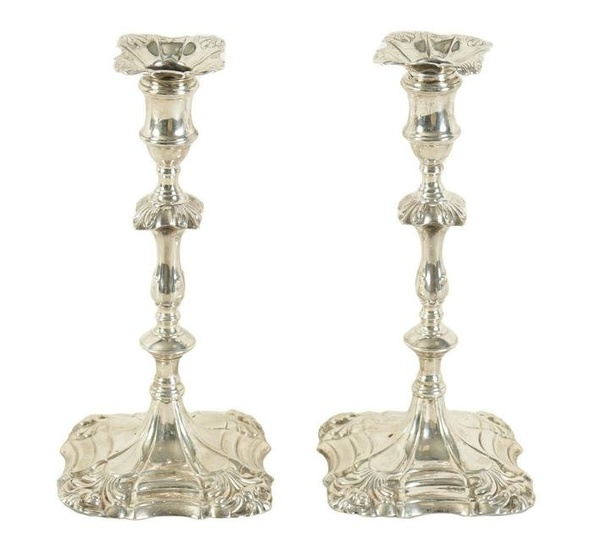 A PAIR OF GEORGE III CAST SILVER 'ROCOCO' CANDLESTICKS