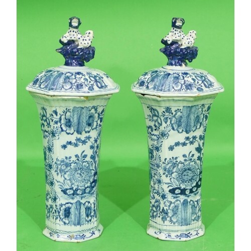 A Pair of Delft Octagonal Bulbous Lidded Vases on white and ...