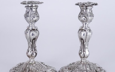 A Pair of Victorian Silver Pillar Candlesticks of Rococo...