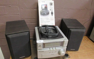 A Panasonic CD stereo system with a pair of speakers...
