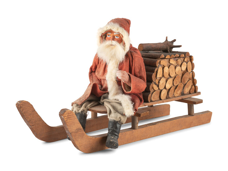 A Papier-Mâché Santa Claus on Log Sleigh