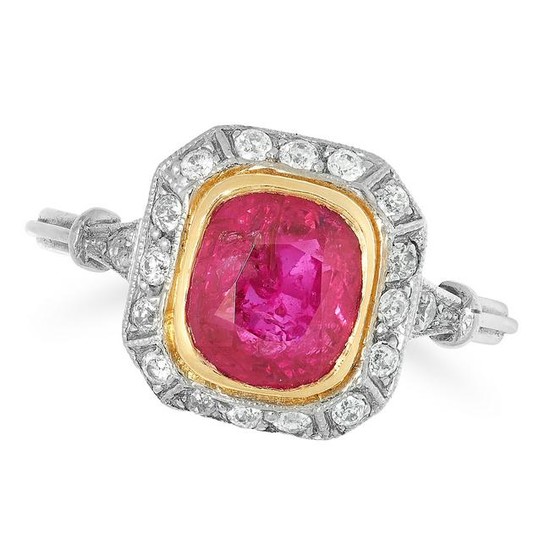 A RUBY AND DIAMOND CLUSTER RING set with a central