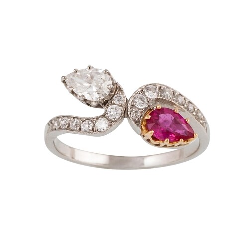 A RUBY AND DIAMOND RING, of cross over design, set with pear...