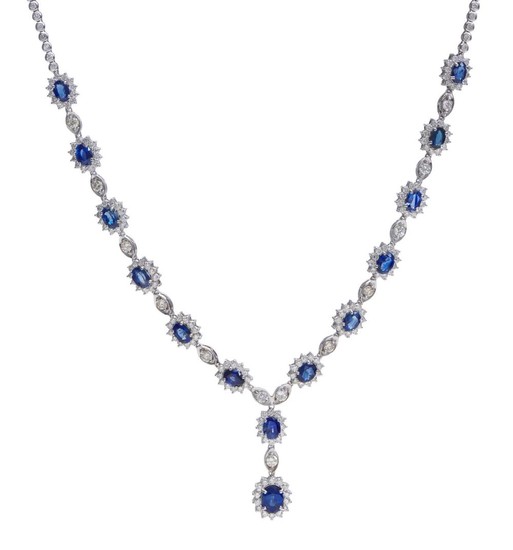 A SAPPHIRE AND DIAMOND NECKLACE - Comprising twelve oval sapphire and diamond clusters interspaced with round brilliant cut diamonds...