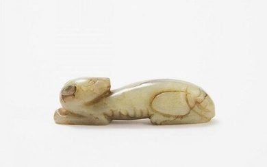 A Small Celadon and Russet Jade Recumbent Dog, Ming