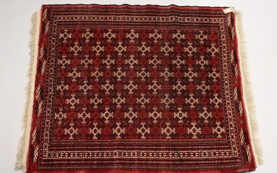 A TURKOMEN YAMUD CARPET, red ground with all over