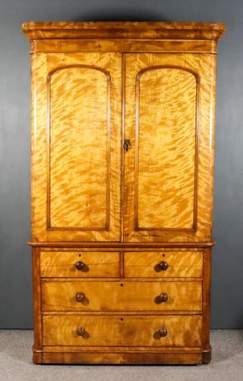 A Victorian Satin Walnut Wardrobe, with rounded front corners,...