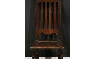 A William & Mary oak side chair, shaped cresting rail, panel...