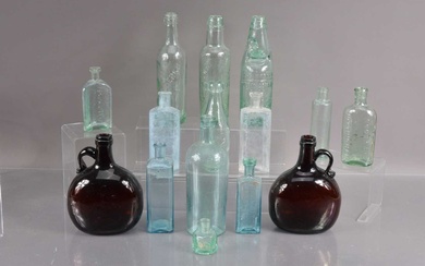 A collection of fifteen antique moulded glass bottles